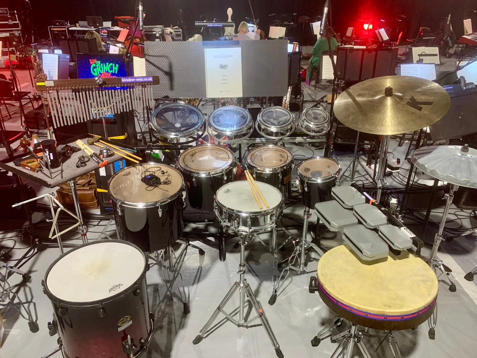 Festival drum riser and backline setup on an outdoor stage