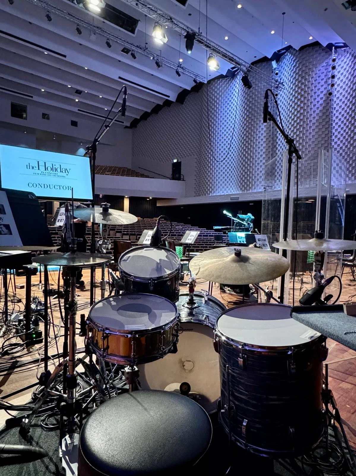 Stage view showing a full backline package under blue lighting