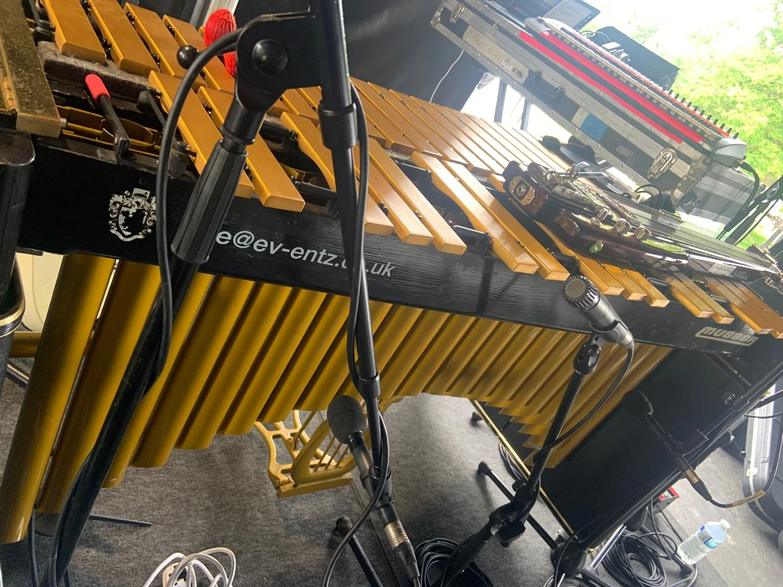 Wide stage shot with drums, amps and keys positioned for a headline set