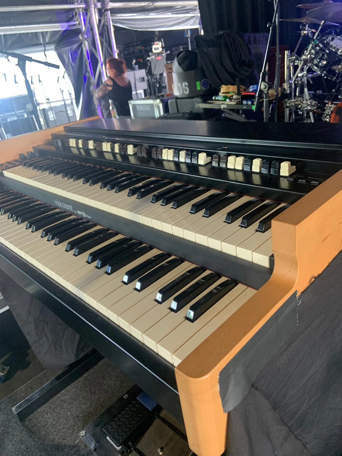 Crew working on stage changeover with cases and carts